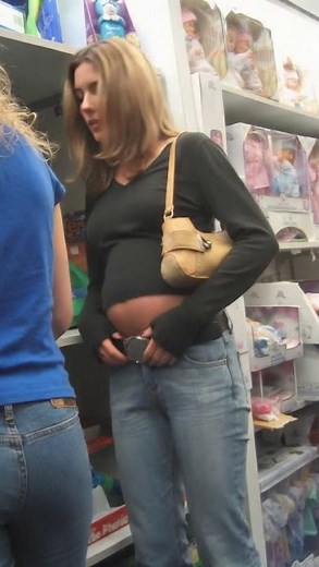 She was looking at toys for her niece when suddenly her belly just blew up like a balloon