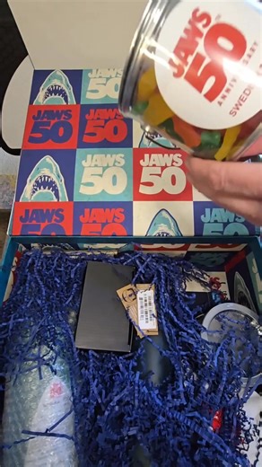 We got an awesome Jaws 50th Anniversary promotional kit! See the goodies like the 4K Blu-ray, gummy sharks, a beach cap, and more! We'll also check out the cool speaker and other fun items to celebrate the summer blockbuster!🦈🎬 Don't forget to check out the special presentation on NBC June 20 and the trilogy on Peacock! #Jaws50thAnniversary #Jaws #MovieMerch #SharkWeek #FilmCollection #SummerMovies #MovieUnboxing #PopCulture #FilmAnniversary #MovieFan | TV Fanatic