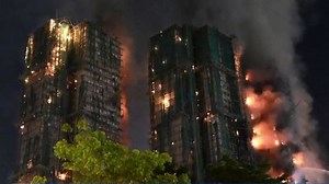 Firefighters unable to search Hong Kong high-rise apartment as fire burns for hours | Haystack News