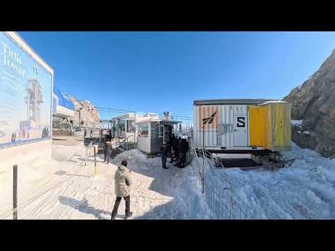 Mount Titlis, The snow mountain view with a glimpse of the Cliff Walker hanging bridge