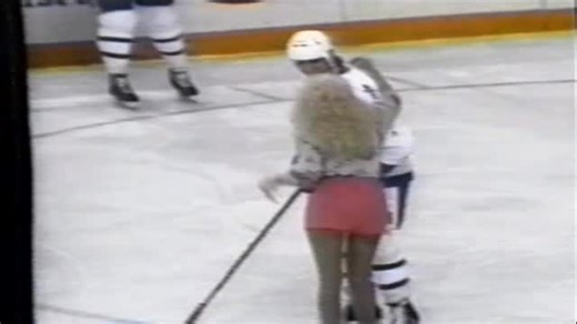 Hockey Rugs on Instagram: "Morganna Roberts, famously known as Morganna, the Kissing Bandit, was a prominent American entertainer and cultural phenomenon from 1969 through 1999. Known for her signature on-field “ambushes,” she would rush onto sports fields—often in disguise—to plant a quick kiss on a superstar athlete’s cheek. I was today years old when I found out she pulled this off during an #NHL game too! #morganna #morgannathekissingbandit #hockeyhistory #hockeyfans"