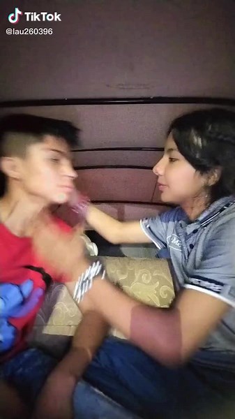 Heartfelt Moment in a Vehicle: A Sweet Kiss