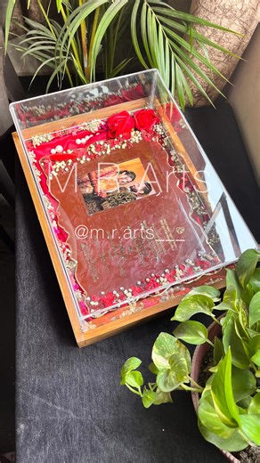 Resin Artist | Handmade Home Decor | Gift Products on Instagram: "Resin Wedding invitation box 🎀 ✨ Maroon & Golden Elegance ✨ A dreamy resin invitation card curated in maroon & golden hues, paired with luxurious golden metal text. Presented beautifully in a wooden tray with an acrylic box covering — pure sophistication in every detail. . 🌷Colour customisation available 🌸Size customisation available . 💌 DM us to place your orders! . We craft something unforgettable for your big day. resin inv