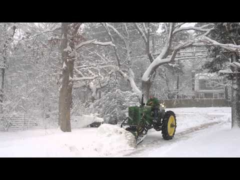 1950 John Deere MT plowing snow