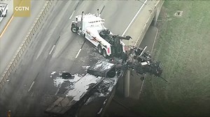 1.2M views · 321 shares | A deadly crash involving a big rig and four other vehicles ended with a large fire along Interstate-30 in Dallas on Friday. The cab of the 18-wheeler was left hanging from a highway guardrail. One person was killed in the accident. | CGTN | Facebook