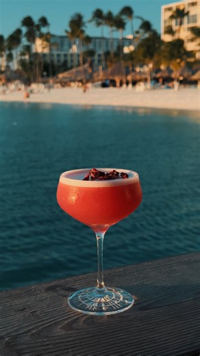 A cocktail with island soul 🌺 Flor de Mar: light, floral, and made for sunsets by the sea | Pelican Pier Aruba