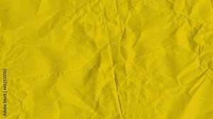 Video background, yellow colored wrinkled paper texture background.