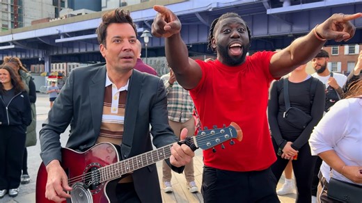 Jimmy Fallon walks off the job to play with street musician