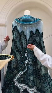 Translating the living landscape of Ninh Binh into textile art!! . This kind of narrative embroidery transforms clothing from mere adornment into cultural storytelling, where each thread carries memory and meaning. 💕 Ninh Binh, with its dramatic karst landscapes, winding rivers, and ancient temples, re-interpretation by Vietnamese designer @lethanhhoa_official 💕💕💕 💕 . What do you think? #lethanhhoa #couturedetails | CoutureNotebook