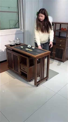 This movable tea table with storage is both space-saving and fully functional!