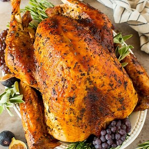 RECIPE: https://www.dinneratthezoo.com/turkey-marinade-recipe/ This turkey marinade is a combination of olive oil, fresh herbs, spices and citrus, all blended together to make the most tender and juicy turkey ever! | Dinner at the Zoo