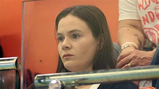 Downcast Holly Ramsay watches her husband Adam Peaty swim