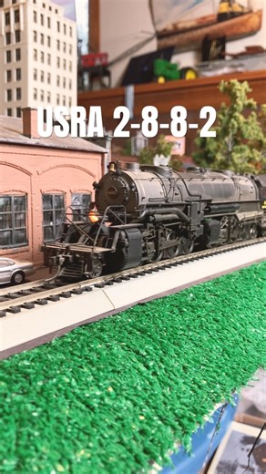 Ho scale USRA 2-8-8-2 mallet hauling the maintenance of way train.