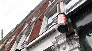 Spinning barber's pole - sign used by barbers at the barbershop