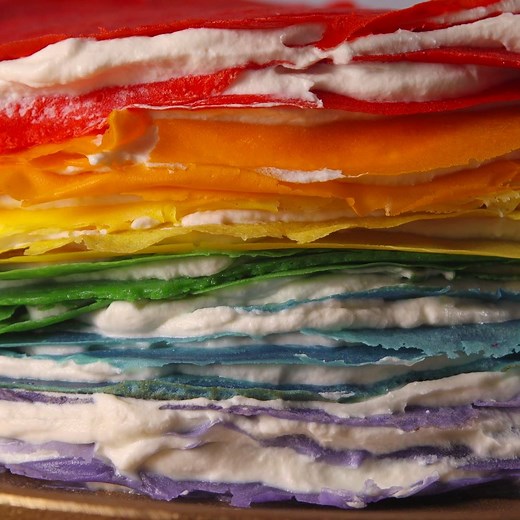 Watching someone cut into this Rainbow Crepe Cake is the most satisfying thing you'll ever see. Full recipe: http://dlsh.it/qjcOtjl | Delish