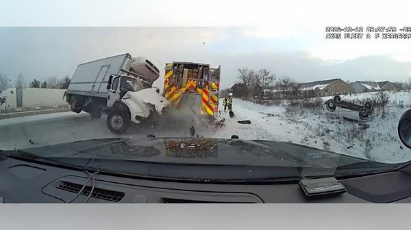 Out-of-control truck jackknifes first responder vehicles on icy highway in Michigan