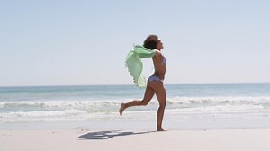 Young woman running at the beach 4k | Free Stock Video Footage