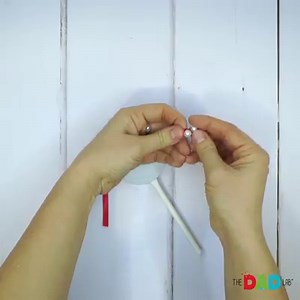 If you can't invite all the friends you want this holiday season for a celebration and you are worried that it is going to be too quiet this year, make these simple rattle drums for your children to bring noise and laughter! (: ⭕ MATERIALS: - Two identical jar lids - Ribbon - Paper Straw - Beads - Glue - Markers ⭕ INSTRUCTIONS: (1) Hot glue a strip of ribbon horizontally one of the lids, leaving plenty of overhangs. (2) Glue the straw vertically onto the lid, having it slightly poke out the top.