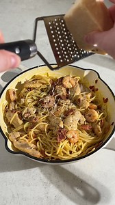 This Copycat Olive Garden Chicken and Shrimp Carbonara recipe combines tender chicken, succulent shrimp, and a creamy, rich sauce made with garlic, Parmesan, and heavy cream. Served over a bed of pasta, it’s the perfect comfort dish that replicates the iconic restaurant favorite. Simple to make and full of flavor, this dish is sure to be a hit at home! | Fork To Spoon