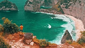Breathtaking top view on tropical beach Bali with scenery lagoon, sand beach and mountain cliff in ocean on nature background Bali, Indonesia 4K