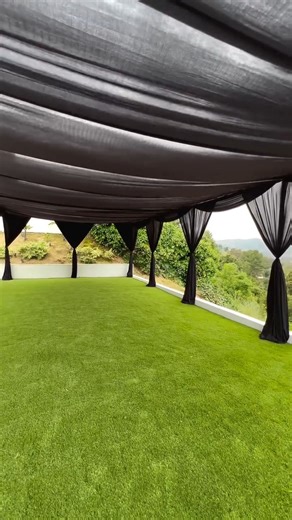 Who says outdoor events have to be all white and bright? 🖤 This stunning black tent transformation by @partypowers is giving us all the sophisticated vibes! The way those drapes flow against the green grass is such a bold, elegant contrast. It’s the perfect proof that going dark with your decor can make a massive statement. #partytent #partydecor #eventplanner #weddinginspiration #blackparty #celebration #decorinspo #tent | TableclothsFactory