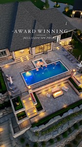 🏡✨ This stunning lakefront property boasts a fiberglass pool and spa, surrounded by extensive retaining walls and elegant staircases that masterfully manage a 30-foot drop to the lake’s edge! 🌊🍃 Paired with the artistry of Antonelli Landscape Design, this space is truly one of a kind. 🛠️🌟 @antonellilandscape #MichiganRealEstate #LuxuryLiving #LakefrontProperty #OutdoorLiving #BackyardGoals #FiberglassPool #SpaDesign #RetainingWalls #LandscapingIdeas #MichiganHomes #LakefrontLiving #DreamHom