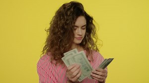 Free stock video - Happy woman counting cash money