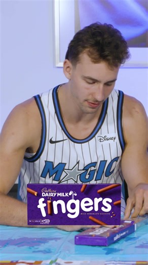 Magic Basketball Team Tries UK Snacks