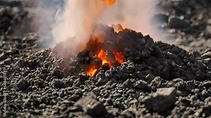 Closeup layer forming burning pile coal consumed flames.
