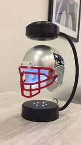 Show your team pride with our NFL Hover Helmet. This mini football helmet has an electromagnetic base that makes it levitate and rotate in mid-air 24/7, plus built-in LED lights. A must-have for your desk! | SharperImage.com