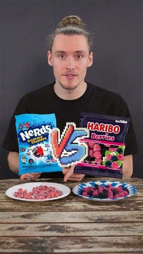 Our German Taste Tester put Nerds Gummy Clusters to the test. Can they beat Haribo Berries? They are very similar with their berry inside and the crunchy outside. Nerds look a bit like they're from outer space and Haribo looks like simple berries. Which ones take the win? What's your take? Tell us in the comments. #TasteTest #Germantriesthings #Expat #Haribo #Nerds | One Stop German Shop - your online destination for German groceries