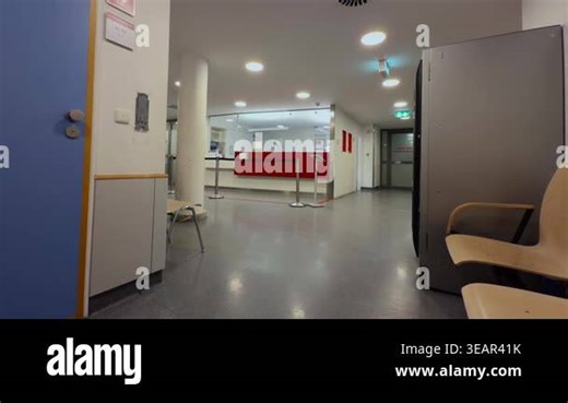 Patient registration desk in a German hospital emergency department. Reception area for self-presenting patients at a medical facility. Clean interior with waiting room chairs and service counter Stock Video Footage - Alamy