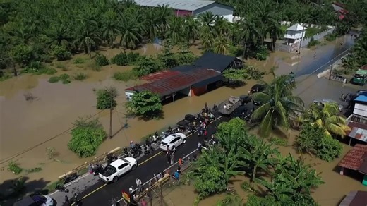Indonesia flood survivors battle mud, trauma