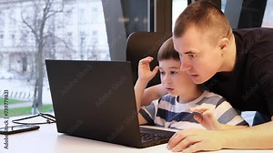 A 6 year pupil with teacher decide a problem using laptop. Man patted the child on the head. Checks a task and notices a good result. Computer education. Studying process. IT Course for kids. 4K