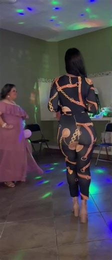 Stylish Jumpsuit Dance at a Vibrant Party
