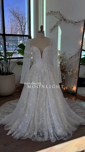 The dreamiest celestial wedding dress 💫 Filled with stardusts, moons, and swirling galaxies. Would you wear Moonlight on your wedding day? 🌌 • • #bridetobe #weddingdress #nontraditionalwedding #weddinginspo #acotar | Flora & Lane