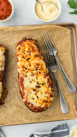 Eggplant Parm — Holy cheesy goodness!! 🍆💥 No breading. No frying. And it’s lower in carbs, cals & fat. You’re gonna love this one!! 💁🏻‍♀️ Comment NEED and I'll send you the full recipe!! | Joy Bauer