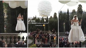 "This is crazy": Bride floats in the air as she arrives her wedding via balloons