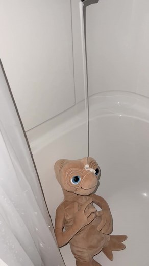Adorable Plush Extraterrestrial Toy in a Bathtub