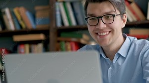 Male university student looking at laptop screen thoughtfully while doing homework. Closeup of concentrated boy trying to fulfill difficult task while studying