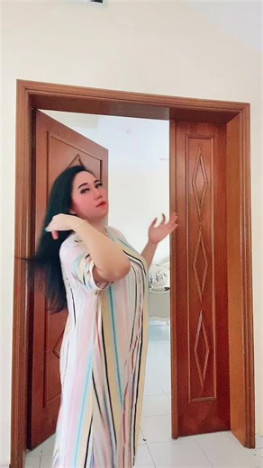 Stylish Striped Dress Showcase in a Doorway