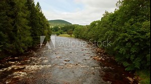 Wide view of river Dee in the Royal Deeside, Aberdeenshire, Scotland, England, UK, a region made famous by Queen Victoria