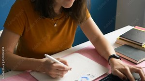 A modern graphic designer draws a new project on his computer