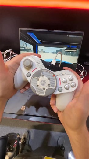 Steering wheel, meet gamepad! The GameSir Smart Drive might be the racing setup that finally fits in my home, because it’s built into a controller. Here’s a prototype I tried at CES 2026, with the full version coming in Q3 for $139. It’s a force-feedback wheel with a surprising amount of force (at least when it comes to thumbs), though this version has USB to power it; the final product will have 2.4GHz wireless. #ces2026 #gaming #ces #gadgets #tech | The Verge