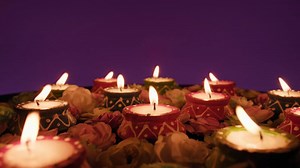 Lit candles circulate for the Indian festival of Diwali