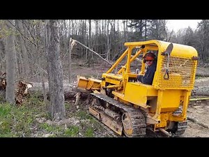 Pulling down trees with the dozer. International dozer