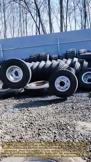 Worker Stands on Forklift Forks to Stack Giant Tires: Manual Tire Stacking with Heavy Machinery