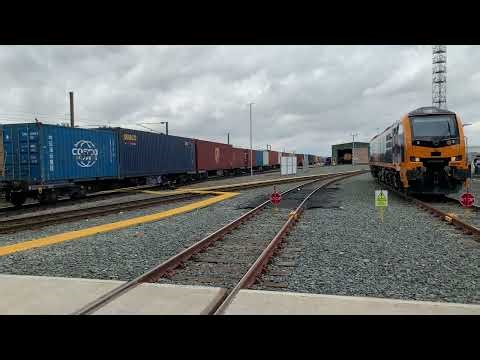 GBRf Class 99002 stands while '66 goes by