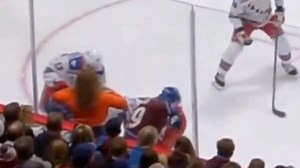Female NHL fan flashes players at Rangers-Avalanche game from front row