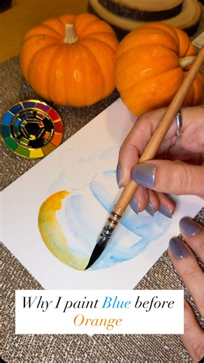 Arezoo | Watercolor on Instagram: "Here’s a pro-level tip to make your fall paintings pop: use complementary colors for your shadows!🎃🎃🎃 Instead of starting this orange pumpkin with orange, I began with its complement, blue, in the areas where the shadows would be (the deep ridges). When you glaze the main color (orange) over its complement (blue), the colors partially neutralize each other, creating a shadow that is deep, rich, and looks completely natural. This technique, called complementa
